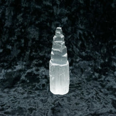 Selenite tower on black background