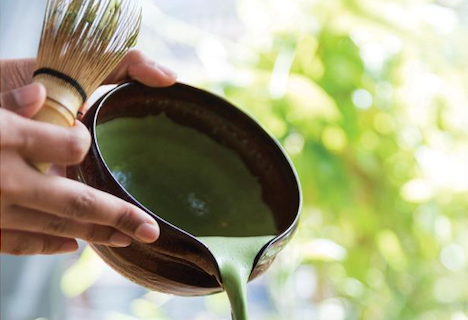 Ceremonial matcha green tea preparation in Japan. Thick tea with a chawan and chasen