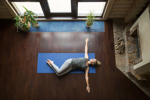 supine twist for a gentle yoga posture for constipation relief and digestive health