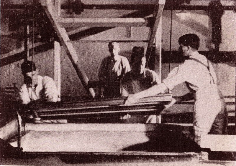 Four men working at Whatman's Contrivance
