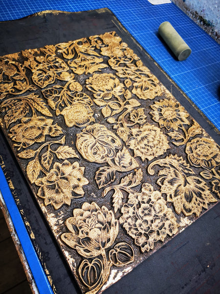 bronze varnish ink on a lino printing block