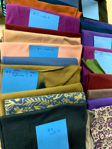 stacks of bamboo fabric with post-it notes