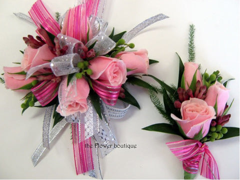 Corsage and Boutonniere Combo Pink 2: Baby Pink Roses beautifully wrapped in shimmery white and pink ribbons