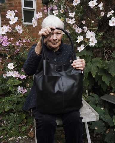 Patsy in her garden with the Eleanor in Noir