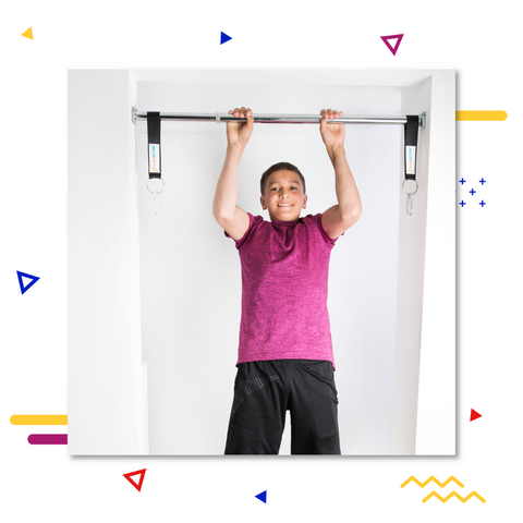 A teenager is doing a pull-up on a doorway chin-up bar.