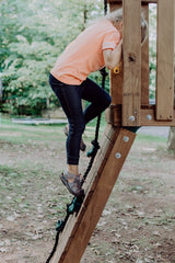 A child is climbing on the playground