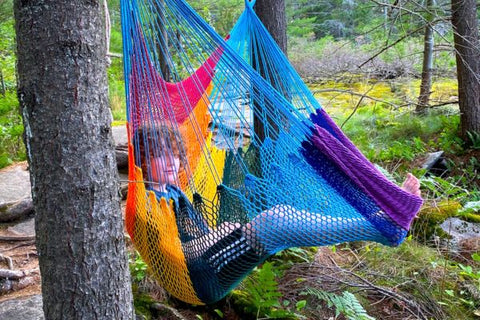 Rainbow hammock swing used outdoors.