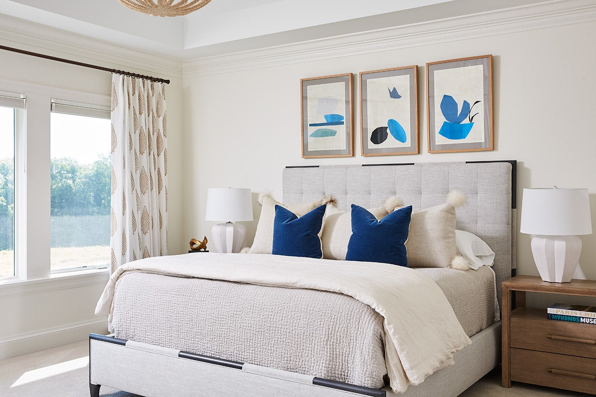 bedroom with blue pillows on bed