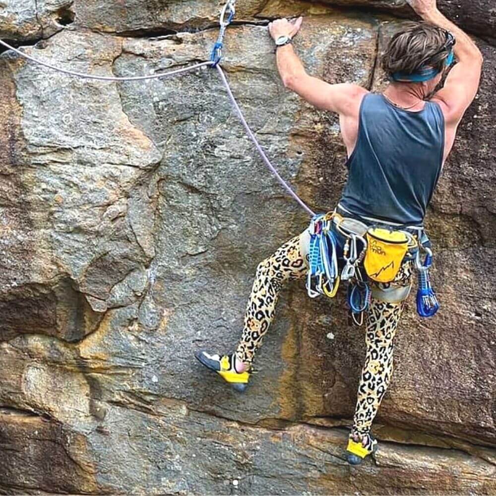 Man rock climbing wearing Kapow’s performance range meggings