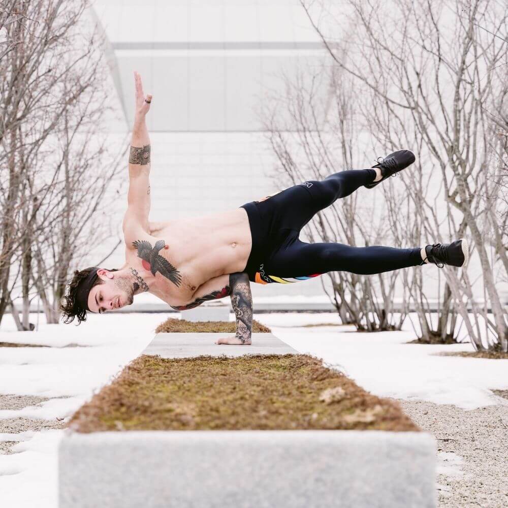 Man wearing a pair of 4-way stretch, super-slick men’s workout leggings that slip on like a second skin