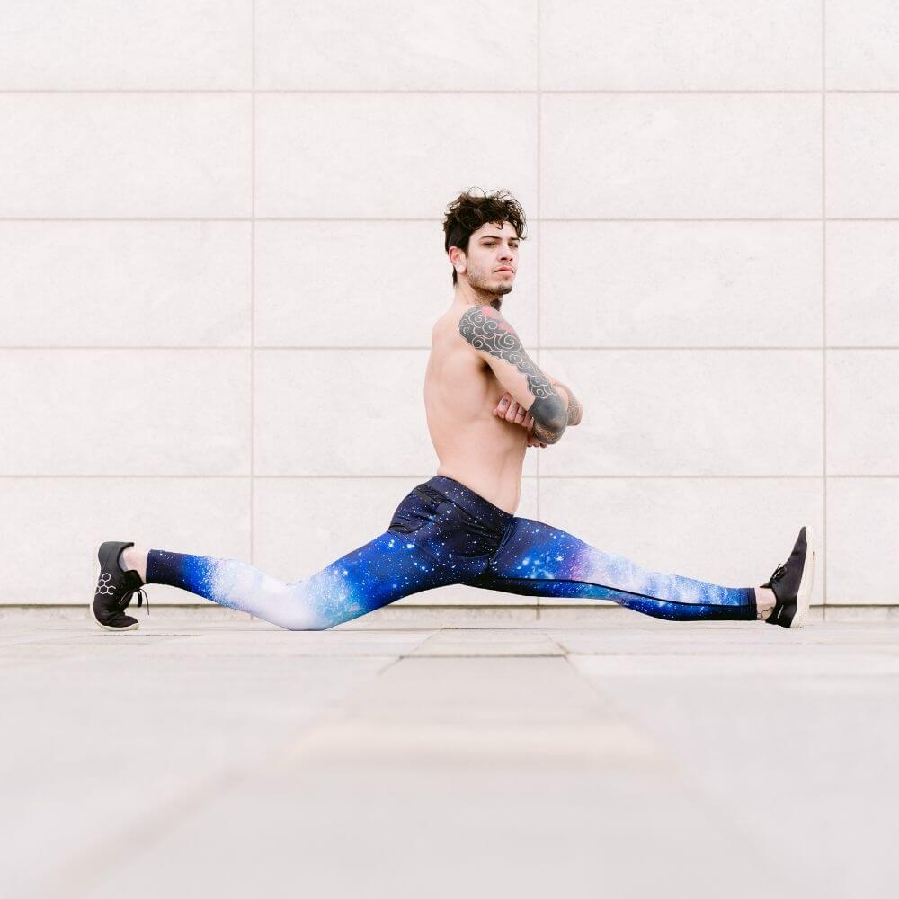 Man doing a split while wearing kapow meggings