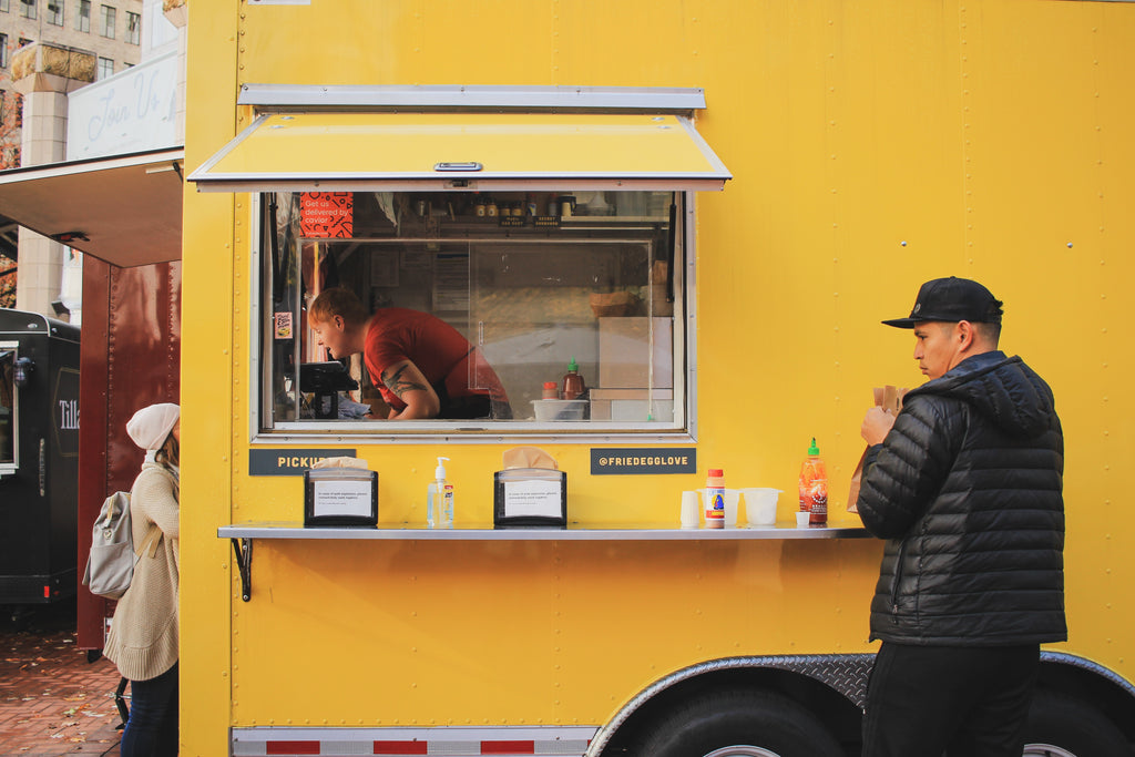 Customers standing by food truck