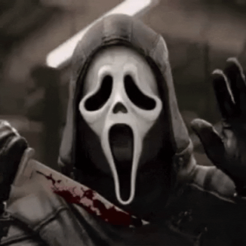 Ghostface from the movie Scream holds a bloody knife.