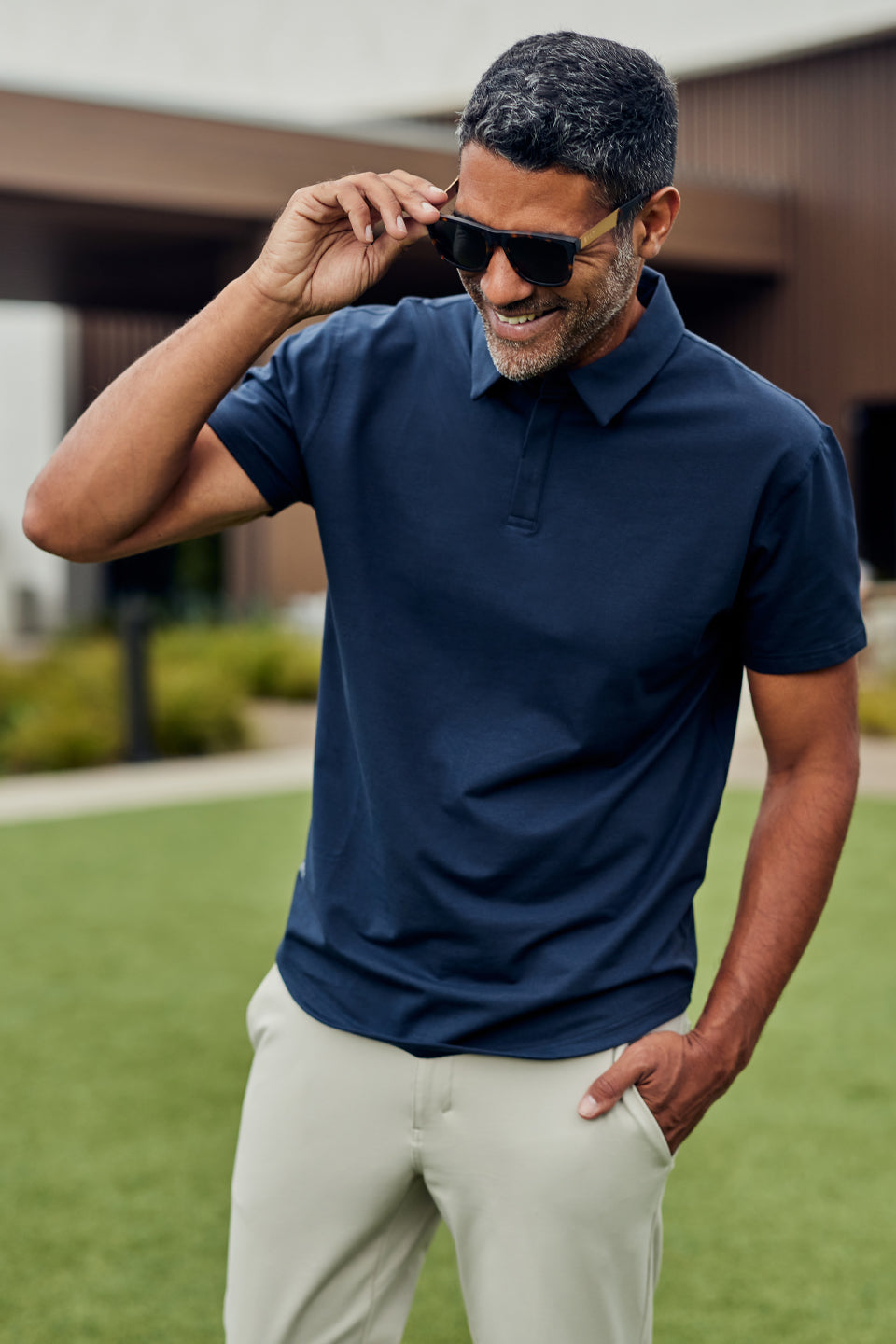 Man wearing BYLT Polo and Sunglasses