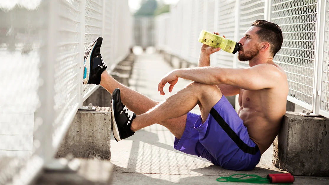 Modern workspace setup with laptop, coffee cup, and notebook on a wooden desk, highlighting productivity and creativity.