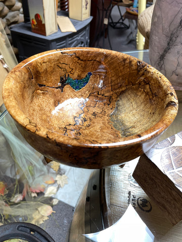 A bowl made from a maple burl with blue epoxy