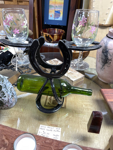 Steel wine glass and wine bottle holder made from horse shoes