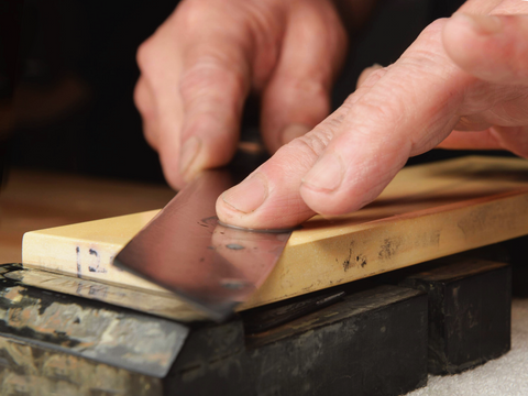 Knife being sharpened