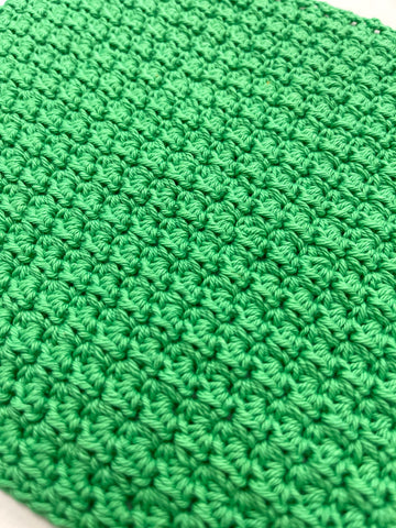 Close up of crochet cluster stitch using Fiddlesticks Wren 8ply cotton in green shade
