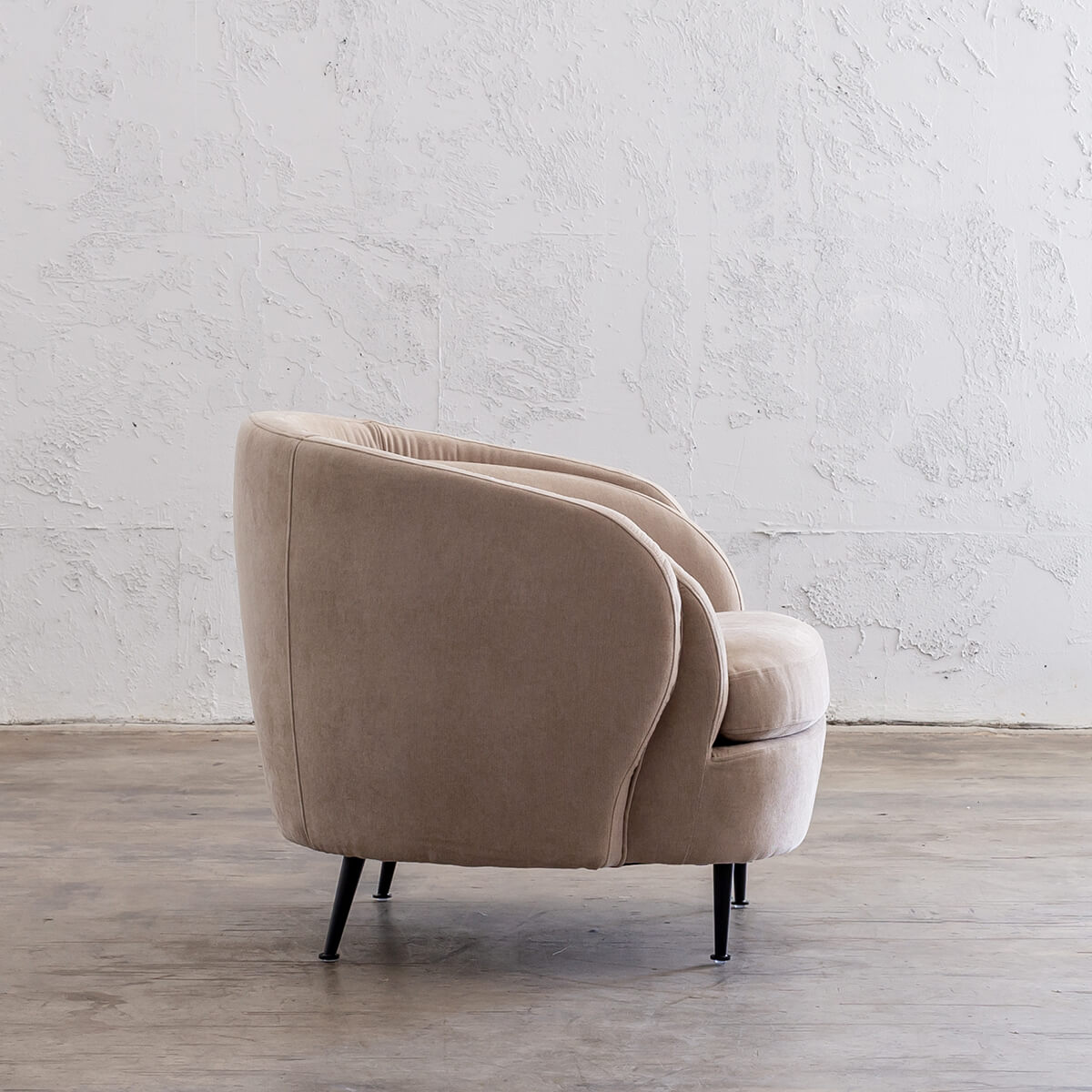 curved arm armchair