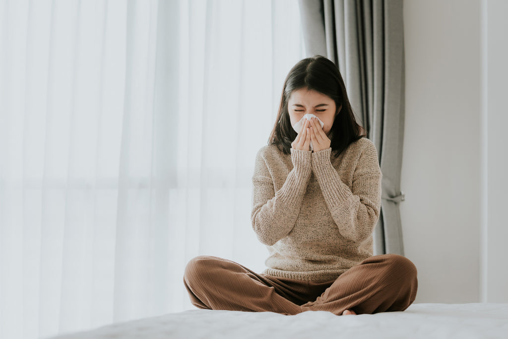 a sneezing woman