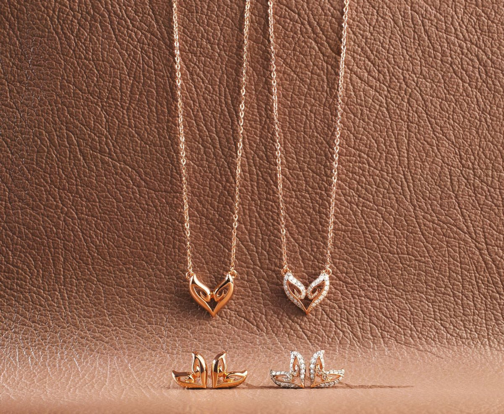 a darling heart shaped duo of rose gold necklace and earrings