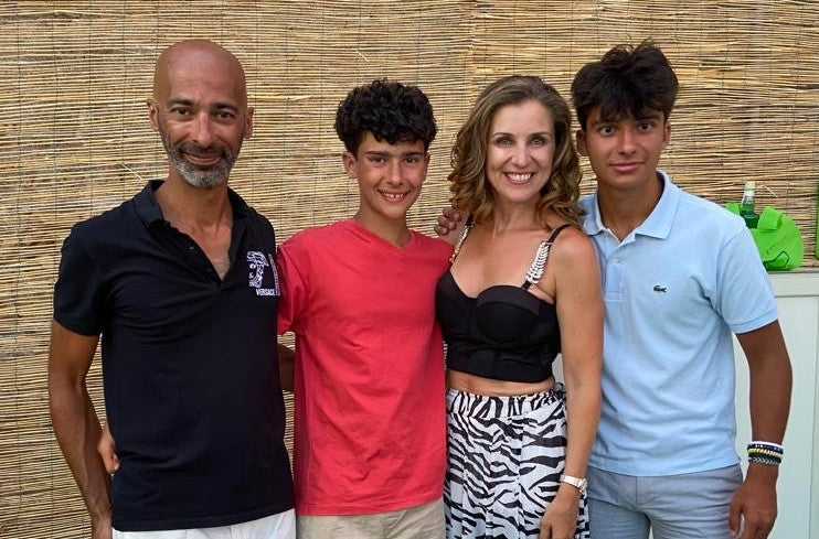 Author Tania Trozzo with her husband and sons at a book signing in Italy