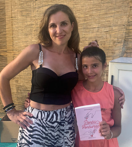 Romance novelist Tania Trozzo and her daughter at a book signing in Italy