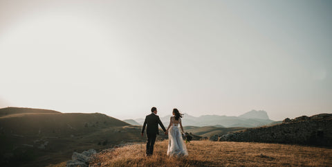 newlyweds at the top of the hill