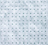 Close up of perforated insulation on a green cutting mat