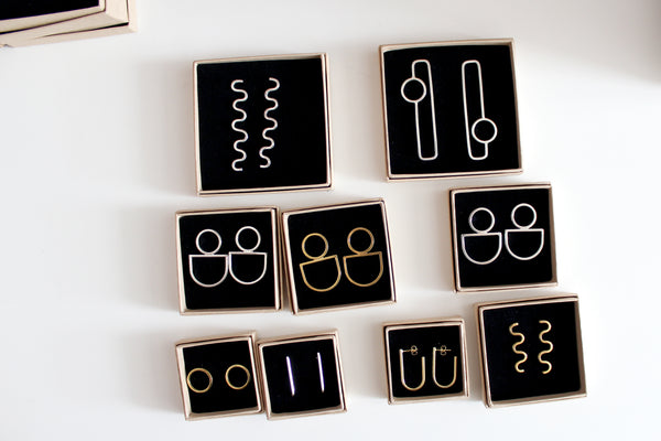 earrings in open boxes by Studio Vincent