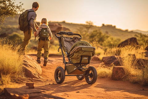 man and child with stroller on a trail