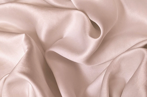 Close-up of nude colored satin silk