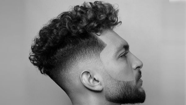 Top 5 Trending Men’s Hairstyles In 2022 – Curly Textured Skin Fade Haircut. 