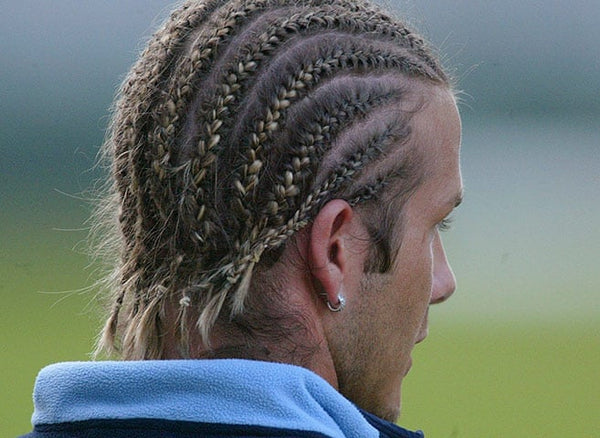 Young David Beckham wearing cornrows hairstyle 