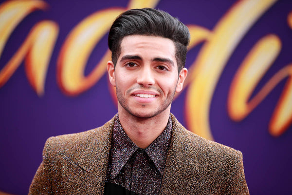 Mena massoud hairstyle windswept quiff straight haircut disconnected undercut Aladdin