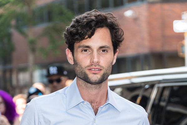 How to get the Penn Badgley hairstyle – curly hair side parting and short sides
