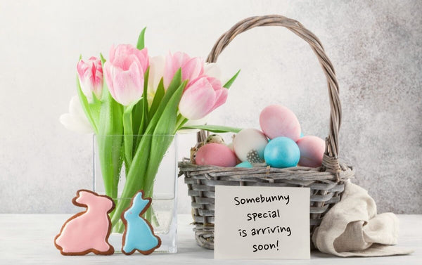 Pink and blue Easter cookies with a "special arrival" note.