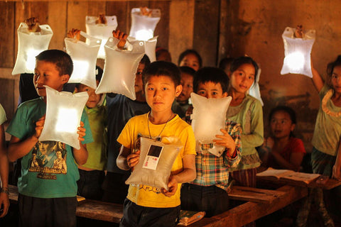 School children holding up their lights.