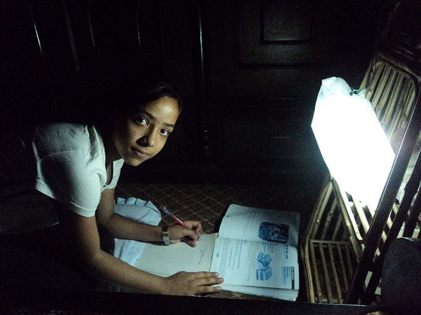 Girl studying in Nepal by LuminAID solar light