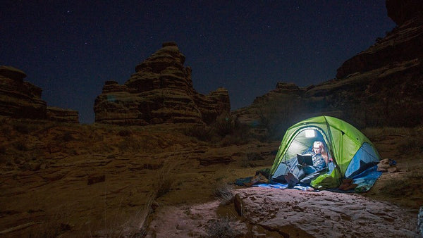 Woman camping in dry land