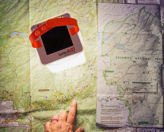 Looking at trail map with LuminAID light Source: Megan McKay