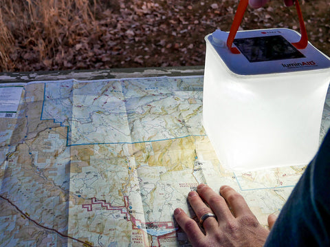 Map on ground with lantern