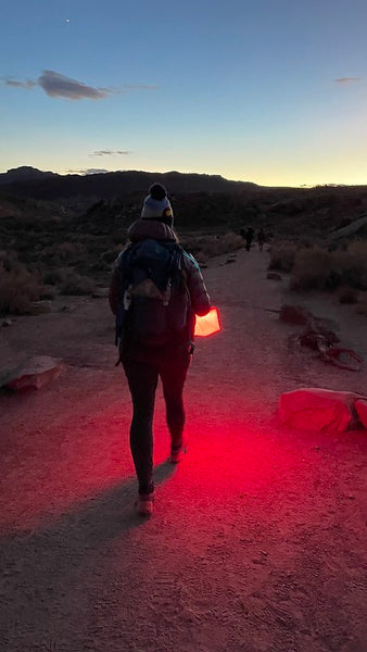 Person hiking early in the morning in Arches National Park Source: Megan O'Brien (IG & TikTok: @theearnestvoyager)