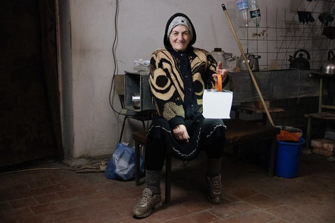 A woman in Ukraine with a LuminAID lantern - credit Sasha Leahovcenco / Mosaic