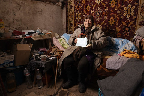 A woman in Ukraine with a LuminAID Lantern - credit Sasha Leahovcenco / Mosaic