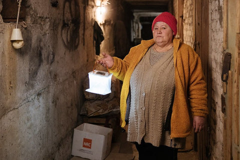 A woman in Ukraine with a LuminAID lantern - credit Sasha Leahovcenco / Mosaic