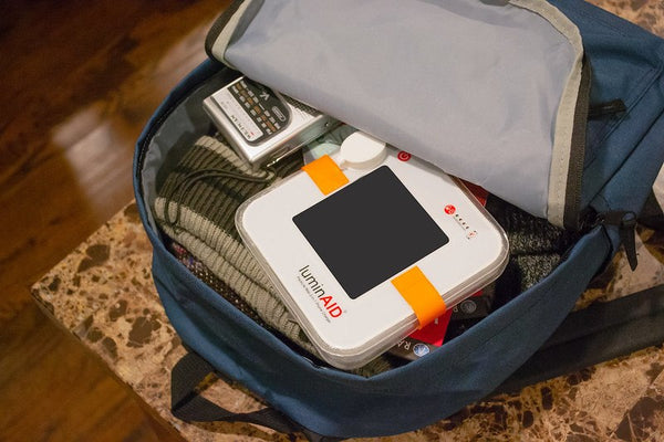 Alt: LuminAID and an emergency radio in bug-out bag. Source: LuminAID