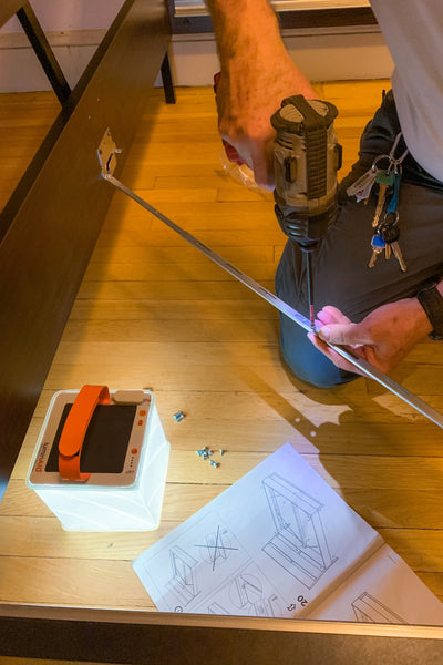 Man building a bed frame. Source: Daphna Gall