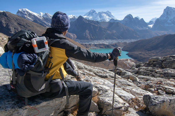 Alt: Hiker admiring Nepal’s mountains. Source: Kamal Gurung